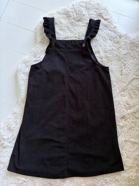 Black corduroy jumper with ruffle